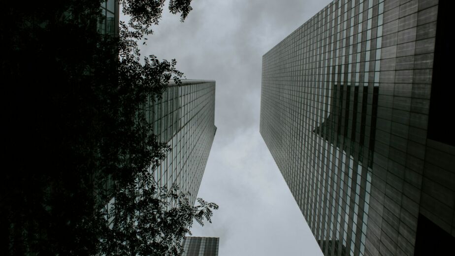 a couple of tall buildings sitting next to each other