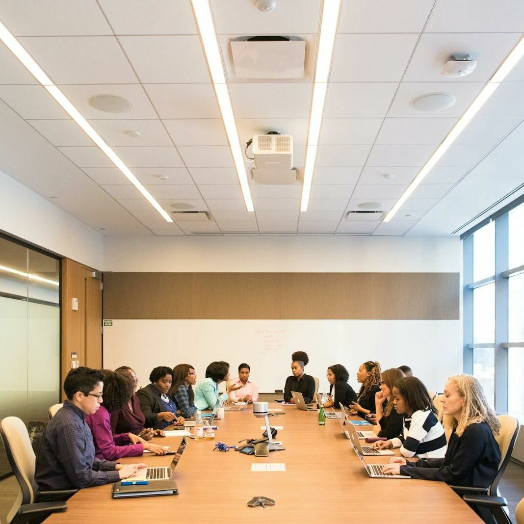 A multicultural team brainstorming and collaborating during a business meeting.